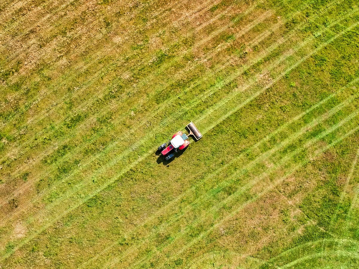 Aerial view of a pasture with equipment working the field