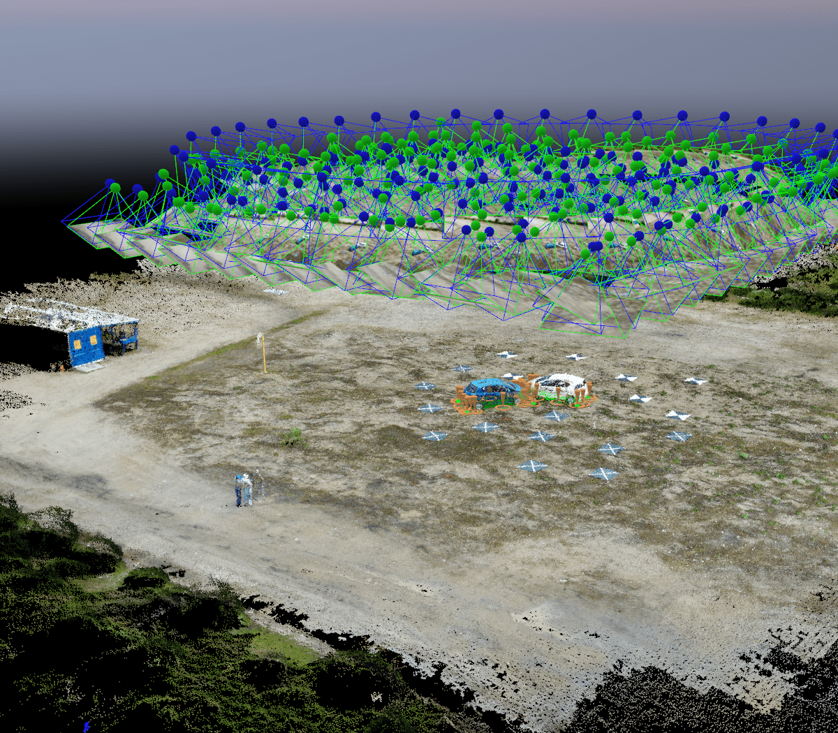 Photogrammetry reconstruction showing hundreds of drone camera positions in a grid above surveyed terrain